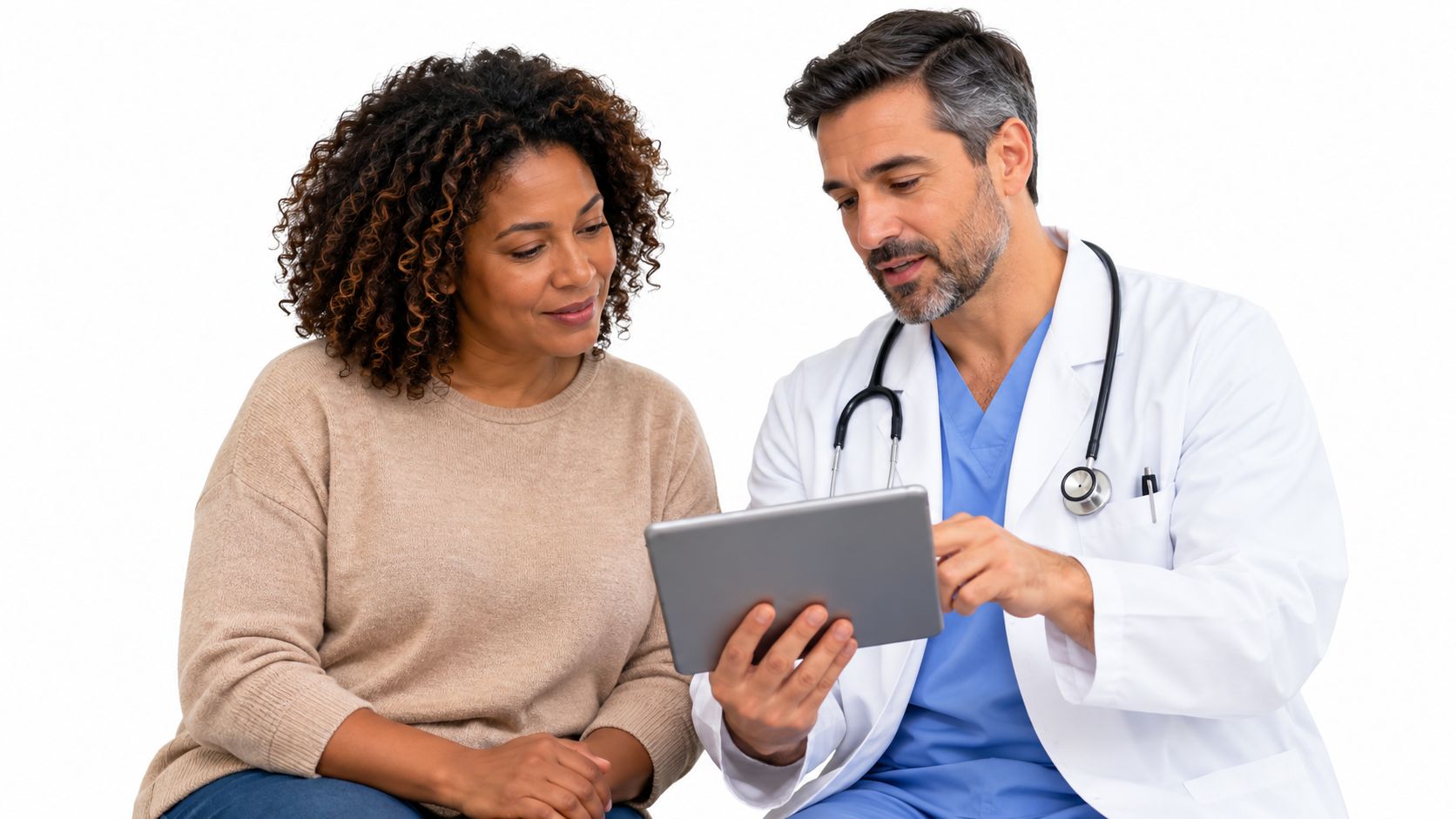 A friendly male doctor shows medical information on a digital tablet to his smiling female patient.